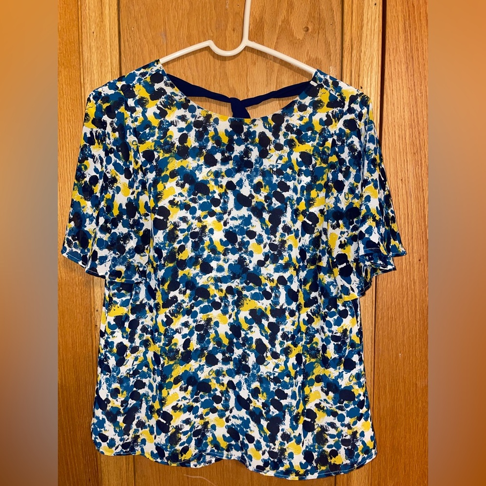 H&M size 8 blouse with tie on the back. So cute